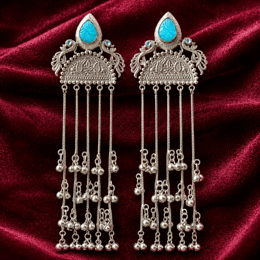 Turquoise cabochon jhumka tassel earrings with long silver-tone dangling chains