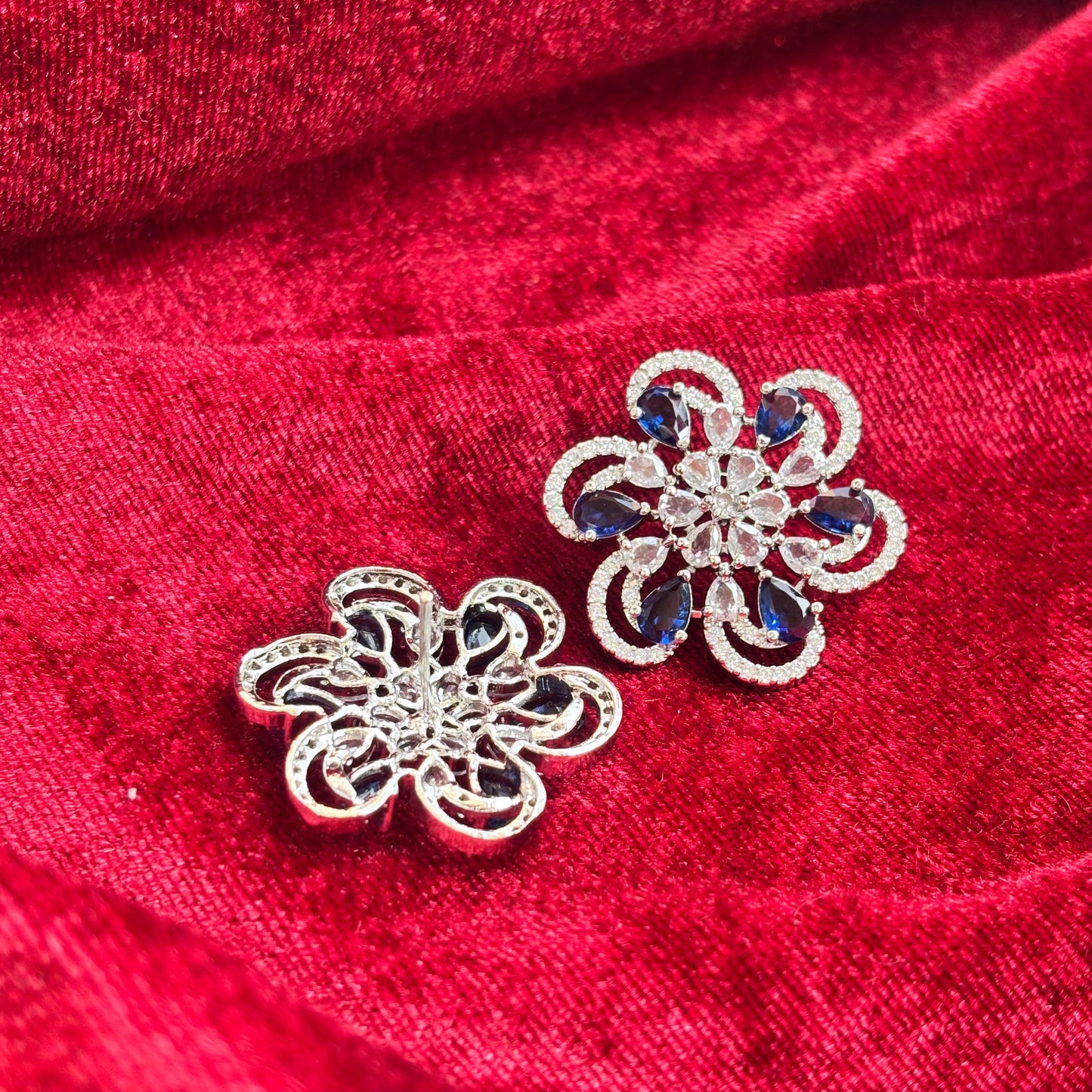 Vionne Six Petal Blue Stone American Diamond Earrings