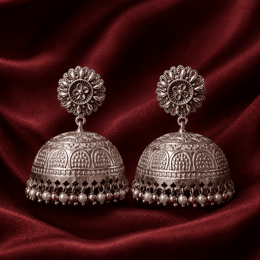 Silver-tone floral dome jhumki earrings with dangling pearl and bead fringe