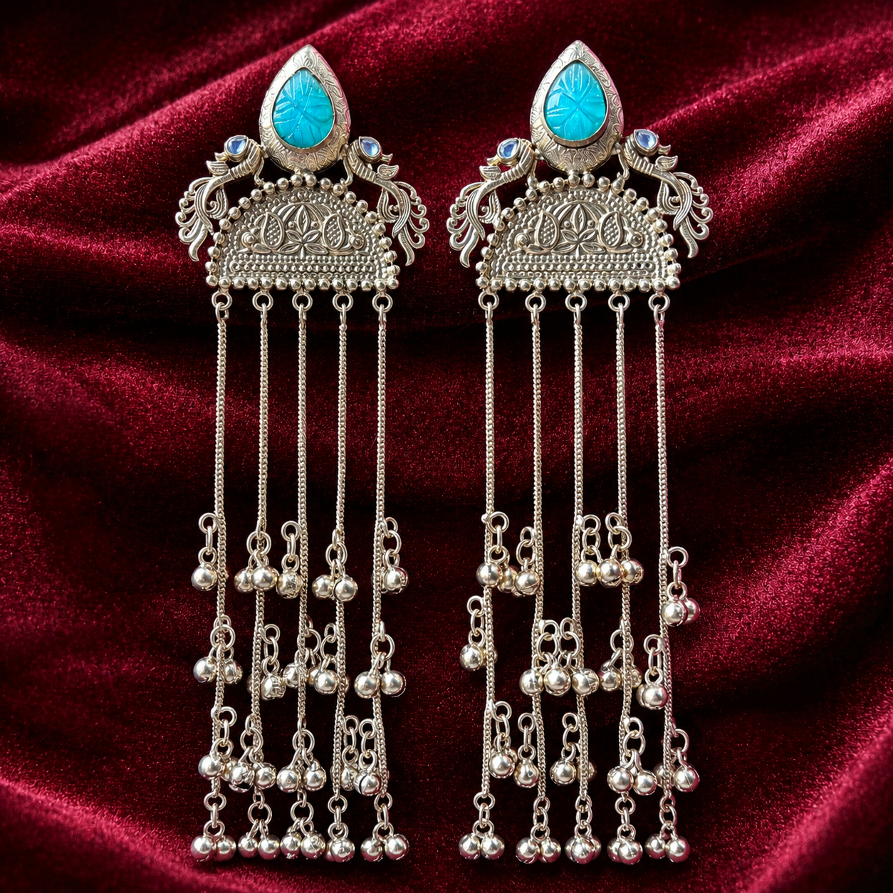 Turquoise cabochon jhumka tassel earrings with long silver-tone dangling chains