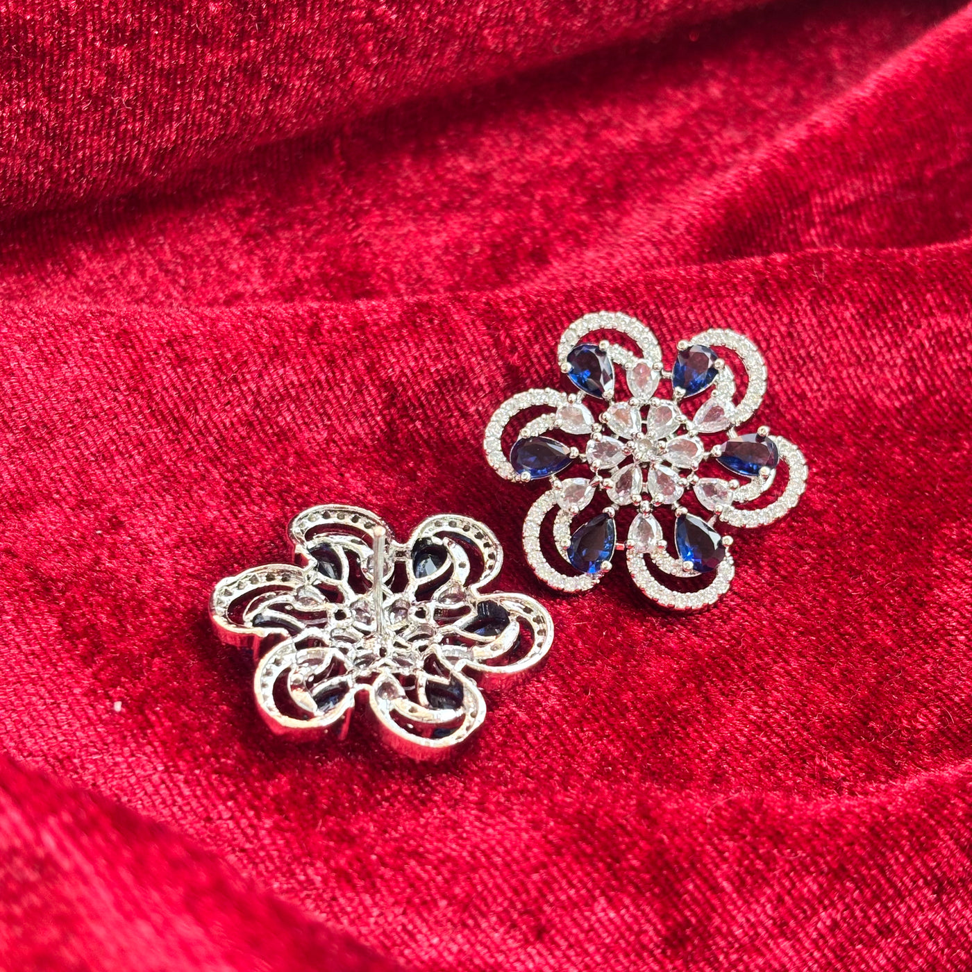 Vionne Six Petal Blue Stone American Diamond Earrings