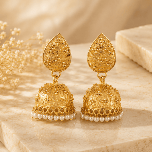 Gold-tone teardrop jhumka earrings with pearl bead fringe drops, front view