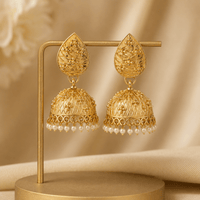 Gold-tone jhumka earrings with textured teardrop tops and pearl fringe dangles