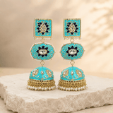 Turquoise dome jhumki earrings with square kundan tops, oval blue halos, and pearl jhum dangles.