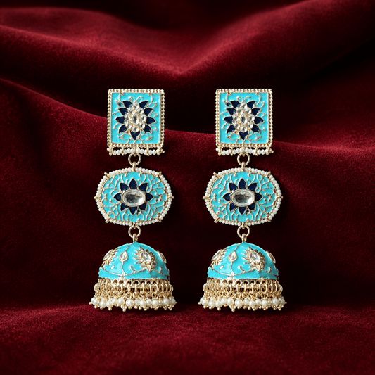 Turquoise dome-shaped jhumki earrings with gold kundan floral tops and pearl tassel dangles.
