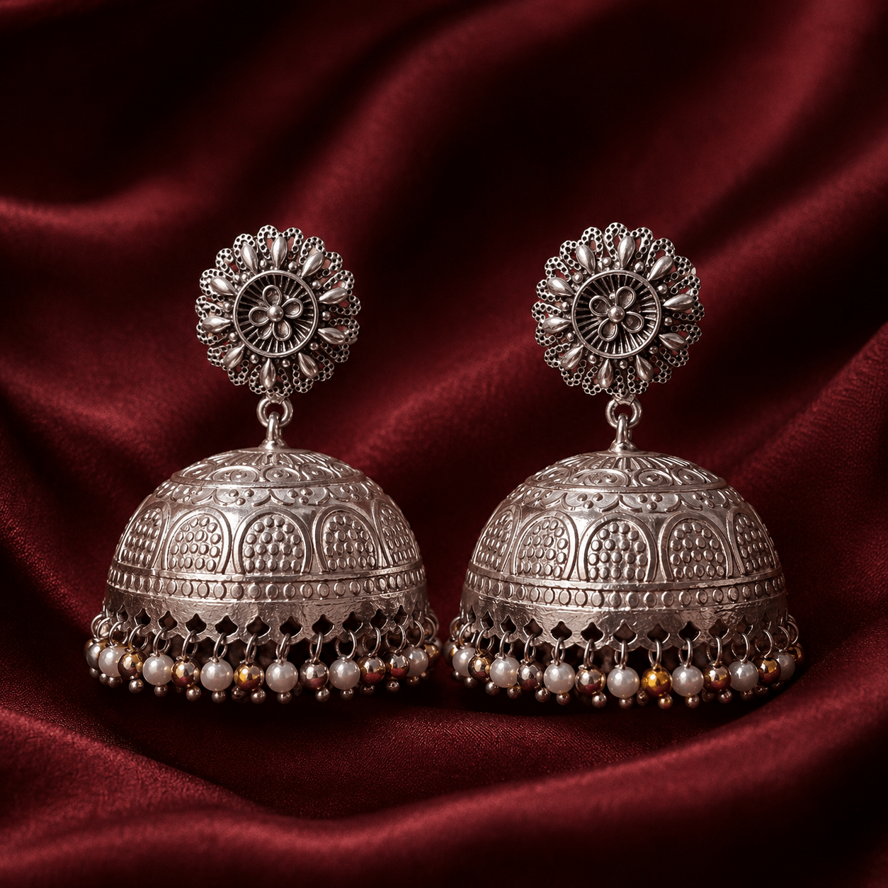 Silver-tone floral dome jhumki earrings with dangling pearl and bead fringe