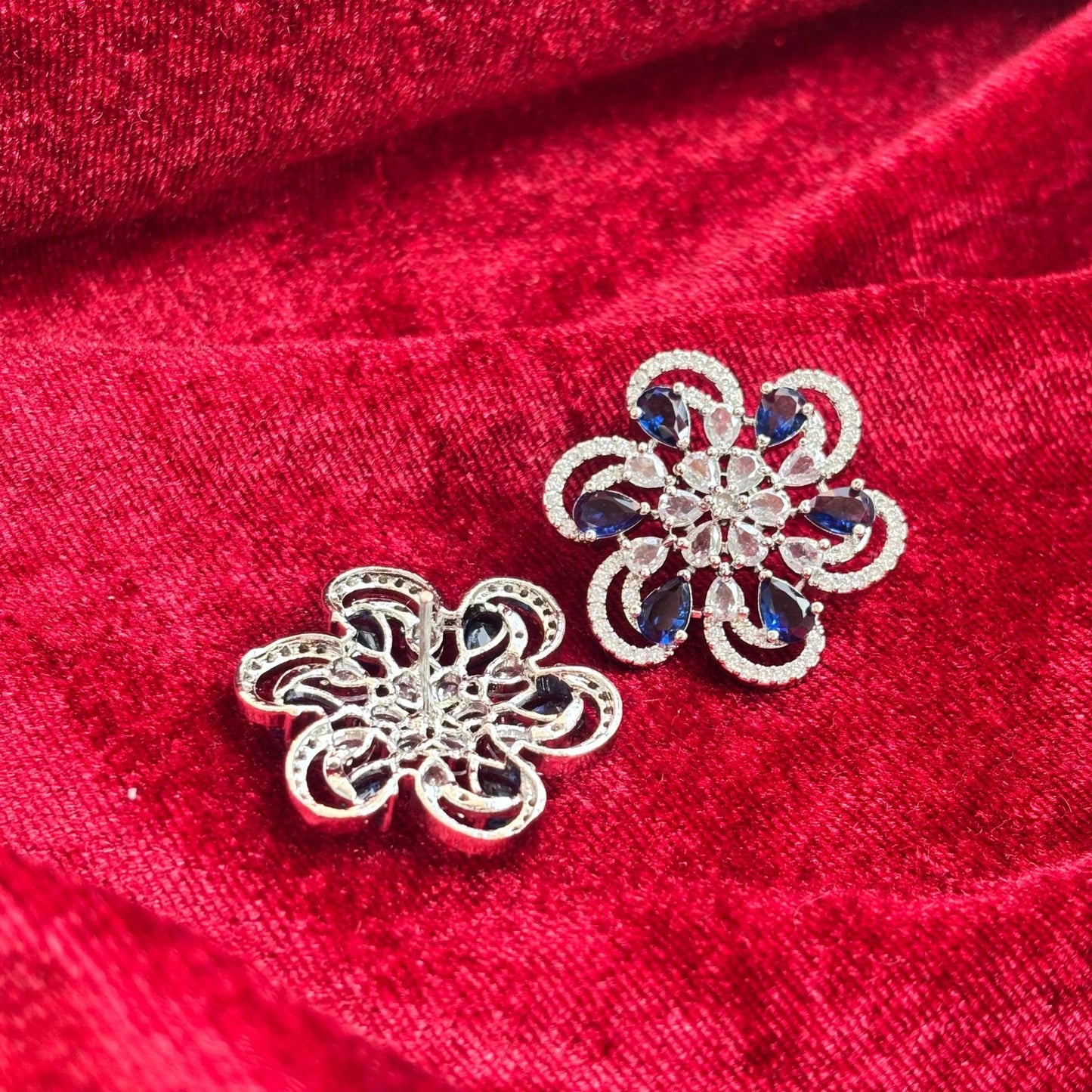 Vionne Six Petal Blue Stone American Diamond Earrings - Jajra